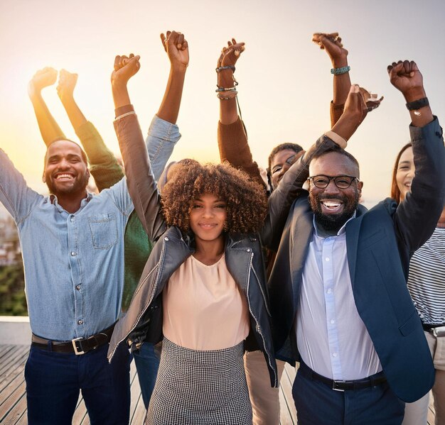 Group of black people happy with arms raised in the air