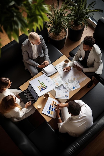 Photo a group of business people are sitting around a table with a chart that says  financial services