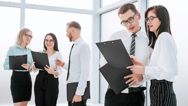 Group of business people discussing documents for a new business project