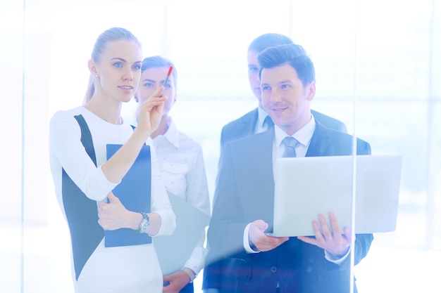 Group of business people doing presentation with laptop during meeting Group of business people