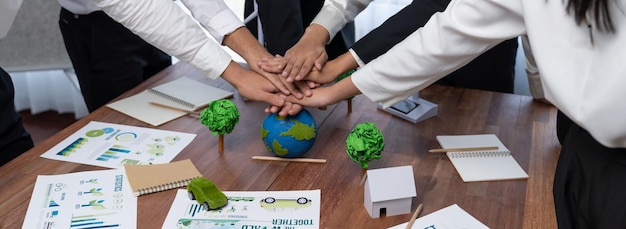 Photo group of business people put hand stack showing eco synergy trailblazing