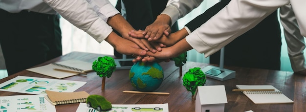 Photo group of business people put hand stack showing synergy of corporate cooperation on environmental protection to save earth environmental awareness and eco unity concept trailblazing