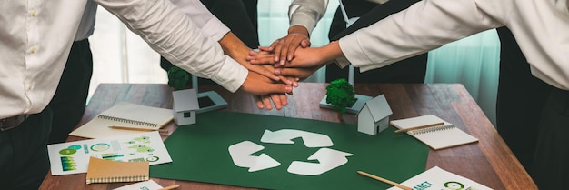 Photo group of business people put hand stack showing synergy of corporate cooperation on environmental protection to save earth environmental awareness and eco unity concept trailblazing