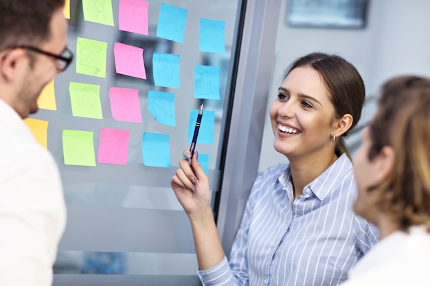 Group of business people sharing ideas in modern office