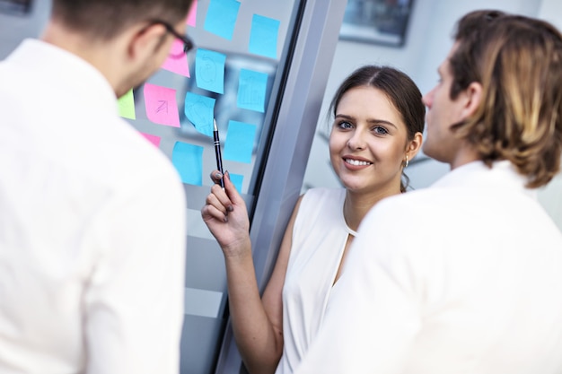 Group of business people sharing ideas in modern office