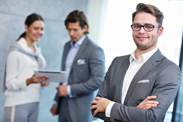 Group of business people sharing ideas in modern office