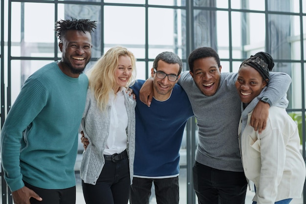 Group of business people standing at the window of a modern office