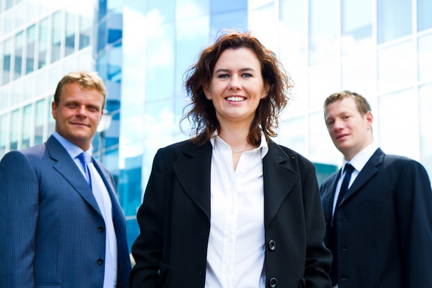 Group of business people with businesswoman leader on foreground 