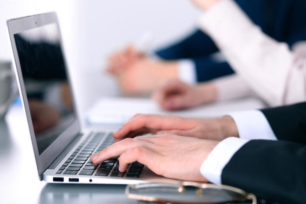 Group of business people working together in office.