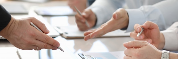 Group of business people writing