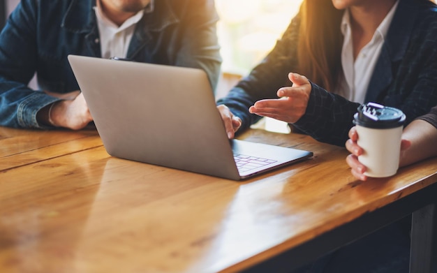 Group of businessman working and using laptop for presentation in a meeting