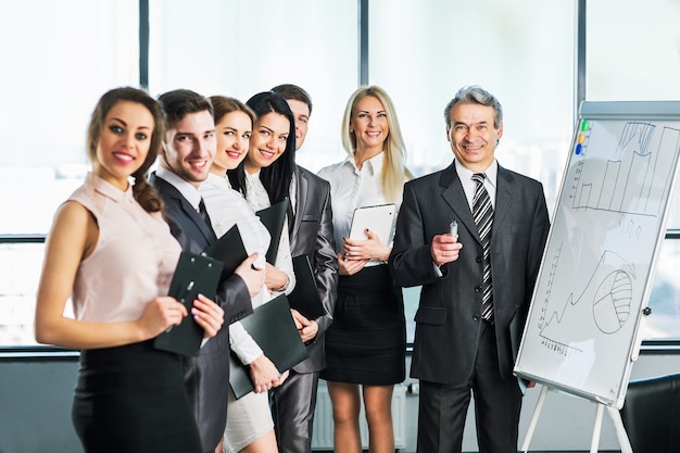 A group of businessmen discussing the policy of the company in the office.