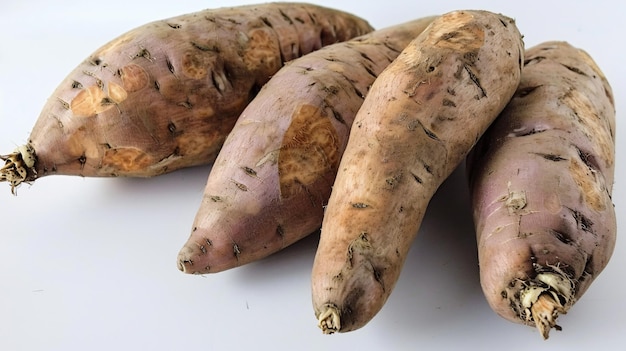 a group of carrots with the roots on them