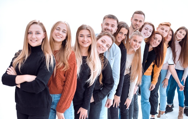 Group of cheerful young people standing behind each other