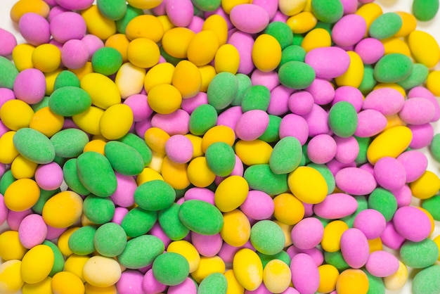 Group of colorful peanuts in glaze. Top view.