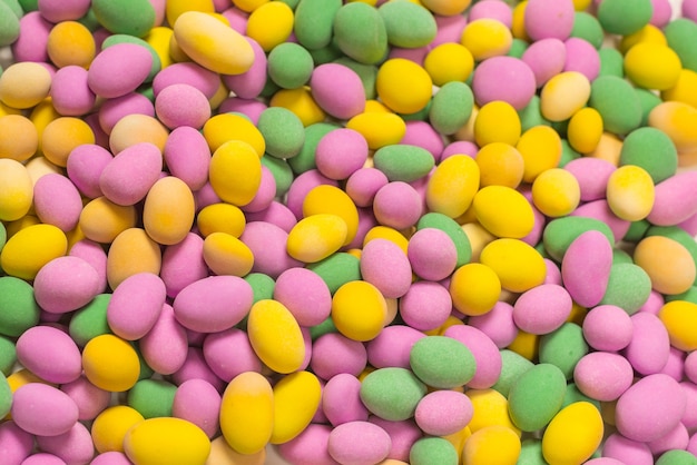 Group of colorful peanuts in glaze. Top view.