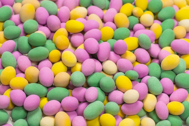 Group of colorful peanuts in glaze. Top view.