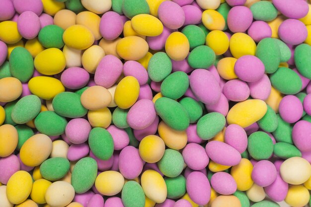 Group of colorful peanuts in glaze. Top view.