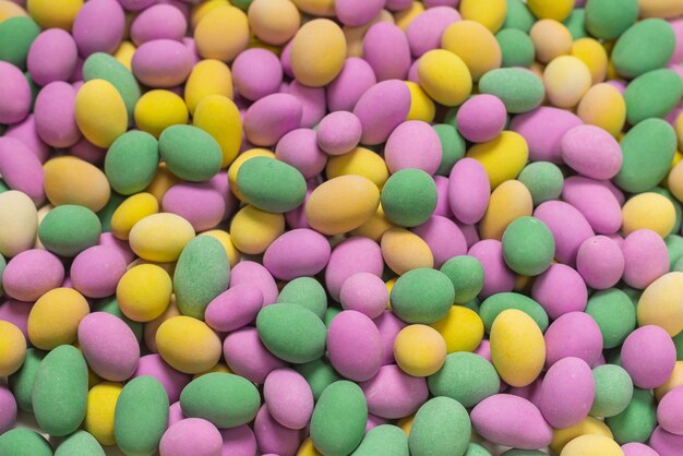 Group of colorful peanuts in glaze. Top view.