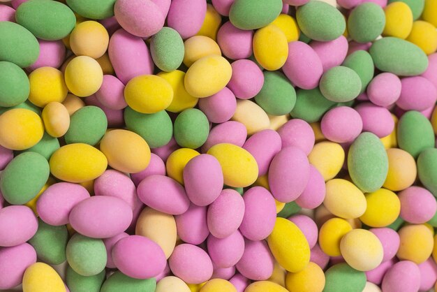 Group of colorful peanuts in glaze. Top view.