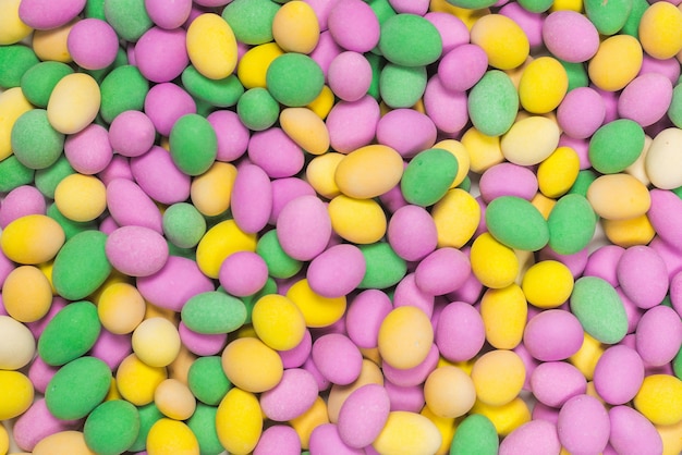 Group of colorful peanuts in glaze. Top view.