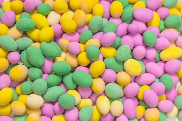 Group of colorful peanuts in glaze. Top view.