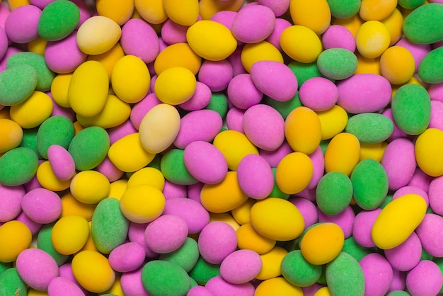 Group of colorful peanuts in glaze. Top view.