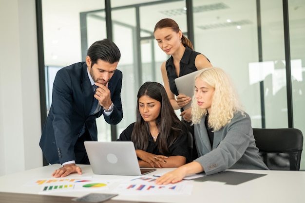 Group of coworkers in formal wear sitting at table in conference room Business meeting team in office