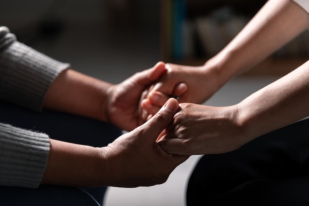 Group of different women praying together Christians and Bible study concept