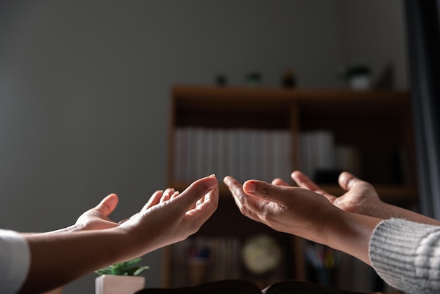 Group of different women praying together Christians and Bible study concept