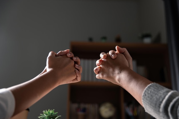 Group of different women praying together Christians and Bible study concept