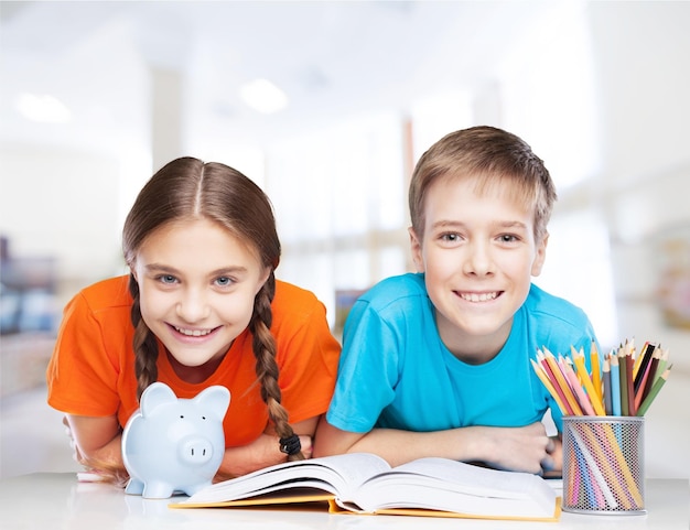 Group of diligent schoolchildren looking at camera in school