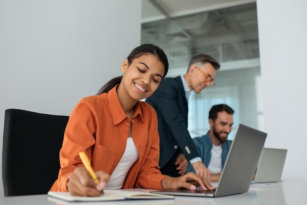 Group of diverse business people using laptop computers working together in office Teamwork