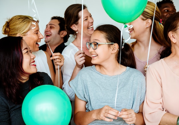 Group of Diverse People Holding Balloons Cheerful