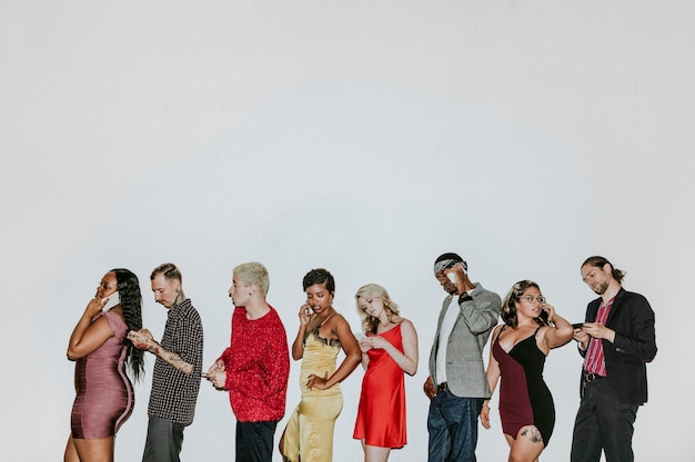 Group of diverse people using smartphones together