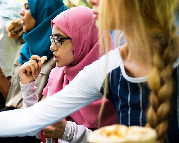 A group of diverse students are having lunch together