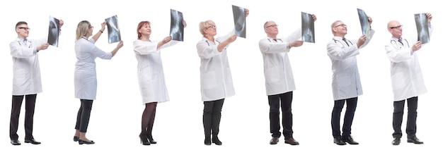 Group of doctors holding xray isolated on white