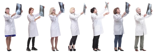 Group of doctors holding xray isolated on white