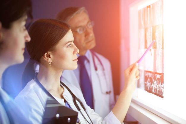 Group of doctors in a hospital Xray diagnostics