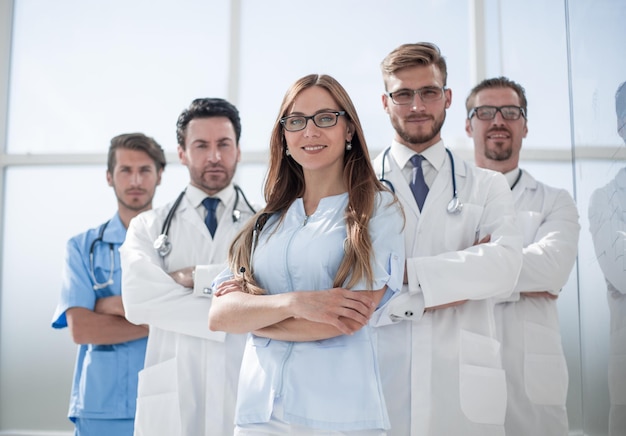 Group of doctors and nurses standing in the hospital room