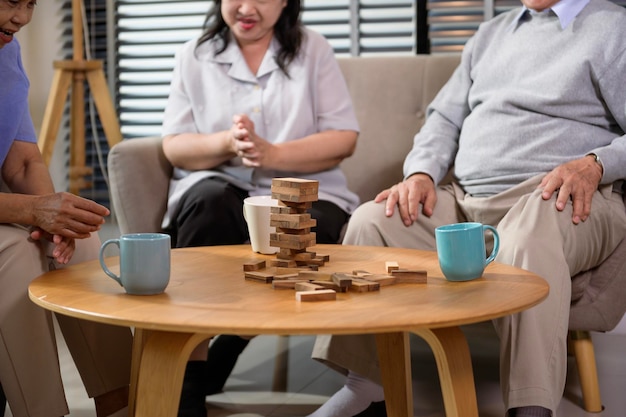 Group of elderly people enjoy talking relaxing with game at senior healthcare center