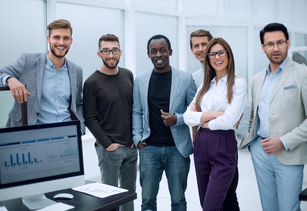 Group of employees standing in the officethe concept of teamwork