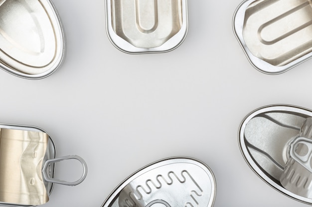 Group of empty tin can isolated on a gray background.Top view Copy space