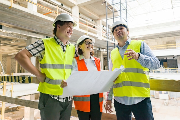 Group of engineers and architects on the building site