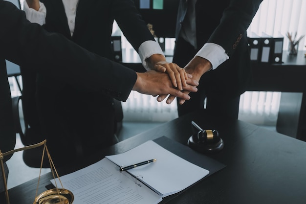 Group of experienced attorneys and lawyers giving consultation to client helping with difficult lawsuit explaining legal procedures and discussing agreement terms Law services and support concept