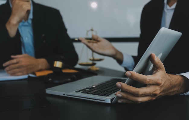 Group of experienced attorneys and lawyers giving consultation to client helping with difficult lawsuit explaining legal procedures and discussing agreement terms Law services and support concept