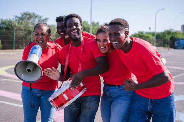 Group of fans of African teams cheering with joy for their team in the World Cup