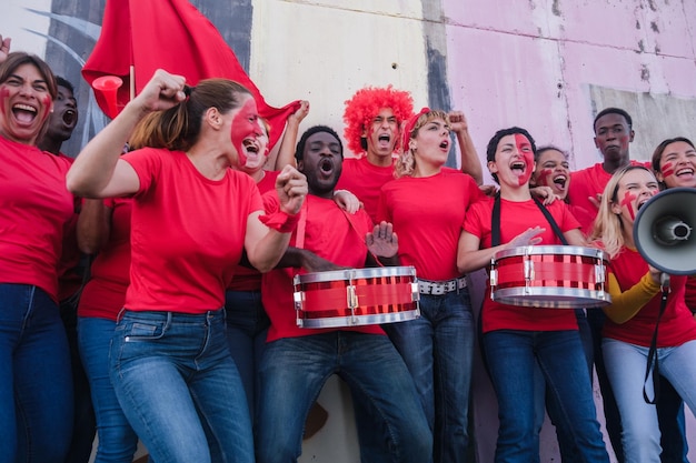 Group of fans from different cultures feeling and defending the colors of their team