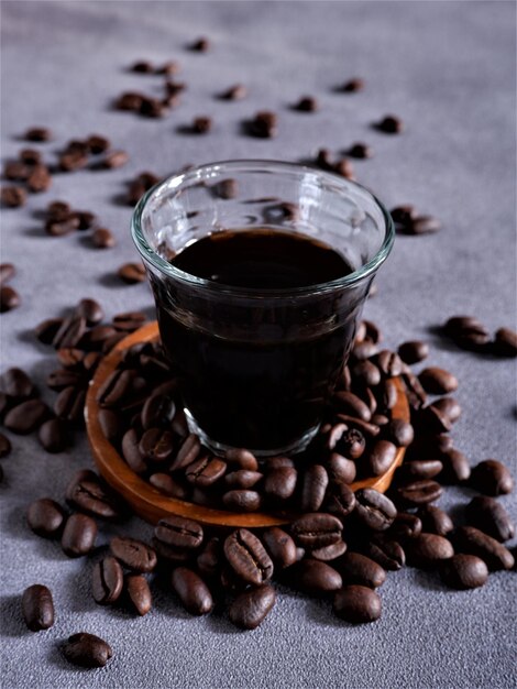 A group of Fresh Arabica roasted Coffee beans on grey background