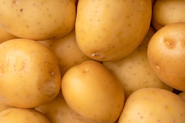 A group of fresh tasty potato as background